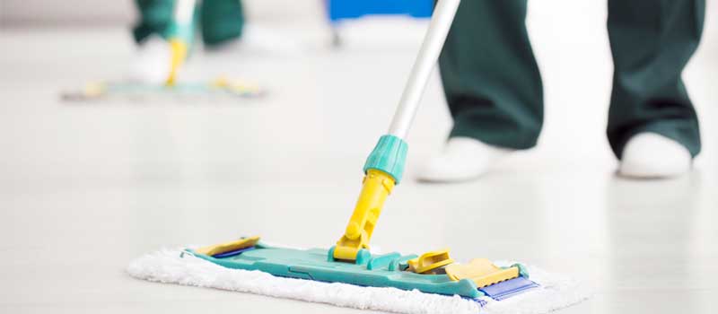 Person holding floor mop